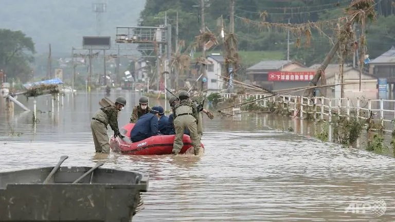 Japanese rafters paddle against the floods amid torrential Kyushu rains
