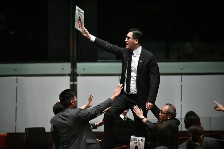 Two Hong Kong opposition lawmakers arrested over protests