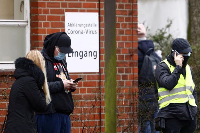 Germany agrees no-mask fines, group limits in virus fight