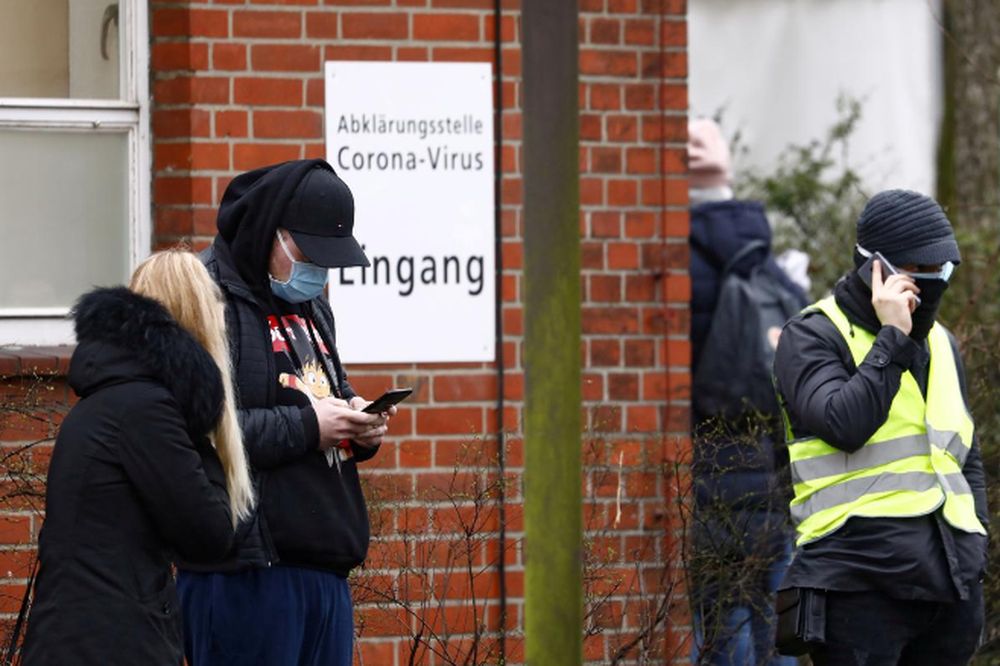 Germany agrees no-mask fines, group limits in virus fight