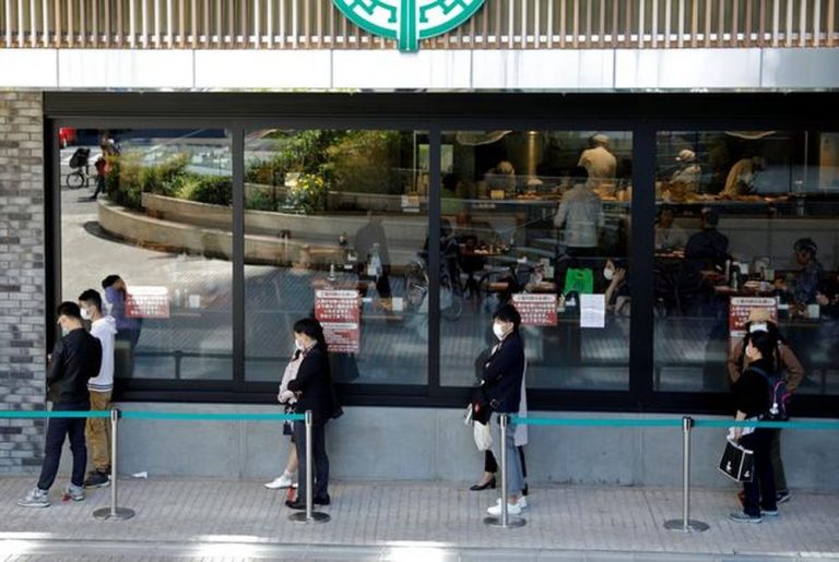Tokyo virus cases hit record 949 ahead of New Year holiday